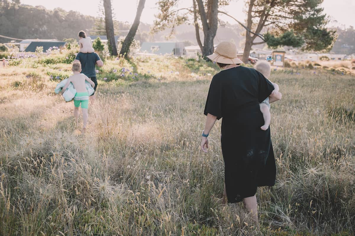 Candid shot of a family walking though dunes