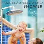 Baby being held in shower by mother