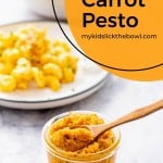 A jar of carrot pesto with text overlay for pinterest.