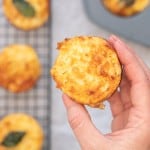 An egg muffin topped being held up to the camera