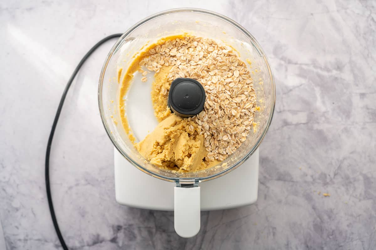 Smooth chickpea paste and whole rolled oats in a food processor.