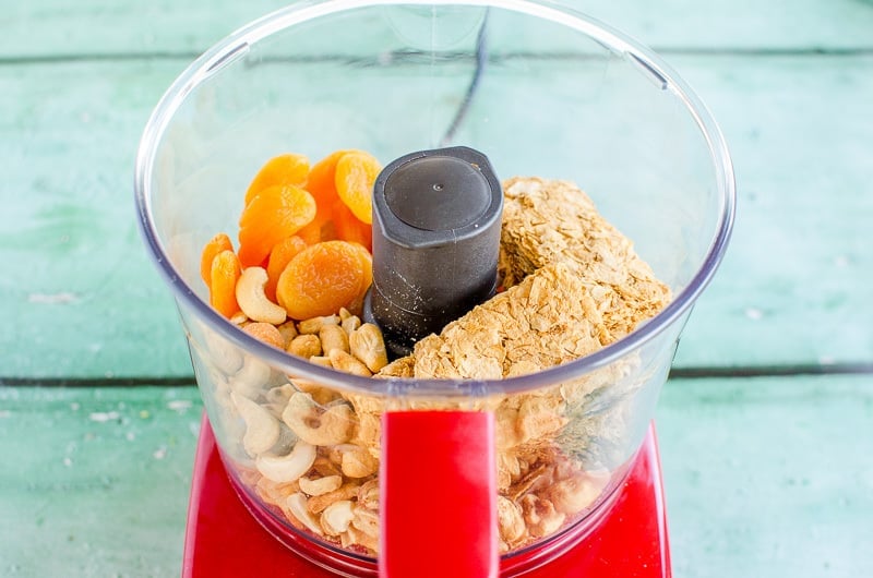 Weetbix, dried apricot and cashews in a food processor