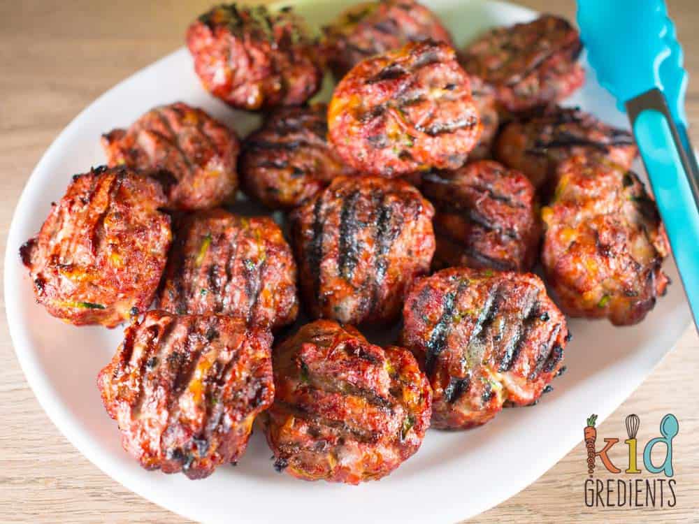 A plate of stacked beef and veggie rissoles.