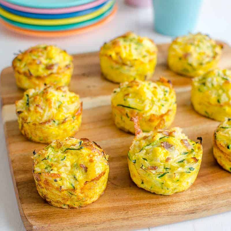 Cooked muffins on a wooden board