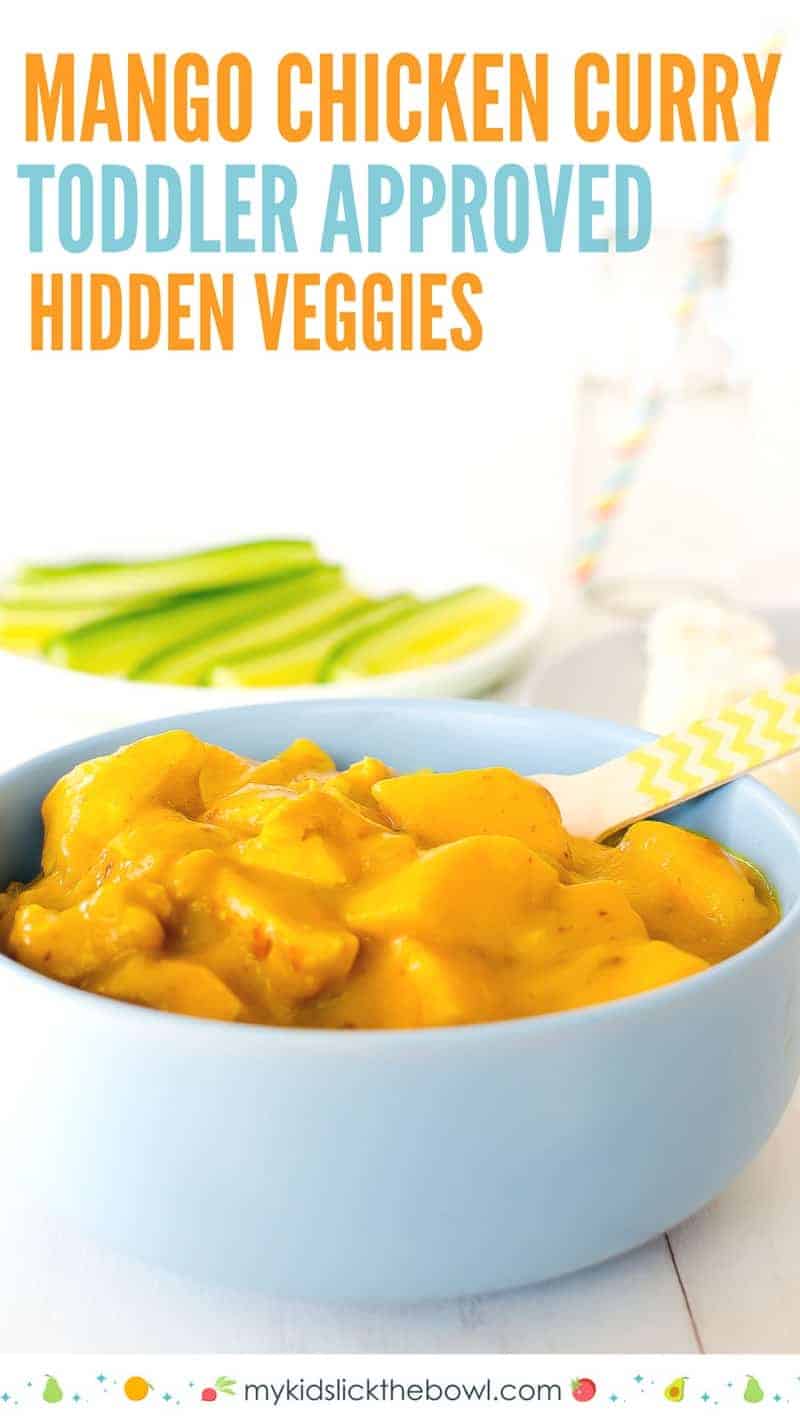 mango chicken curry in a blue bowl with cucumbers in the backgrounf
