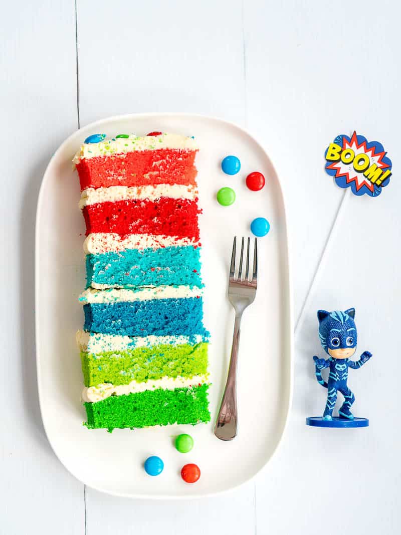 PJ masks rainbow layered birthday cake, piece on a plate