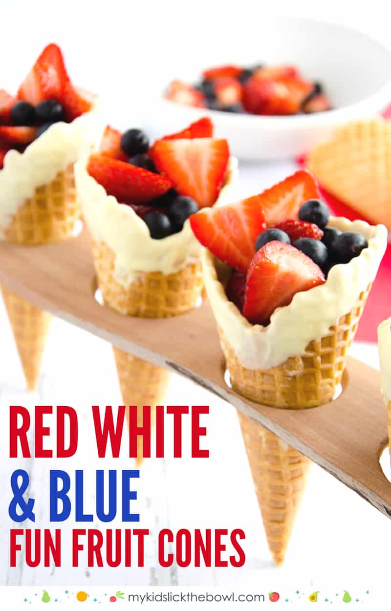 Red white and blue cones, ice cream cones in a wooden rack filled with red and blue berries