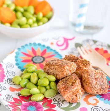 baked salmon bites with edamame beans on a colourful plate