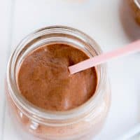 Chocolate chia pudding with a pink spoon