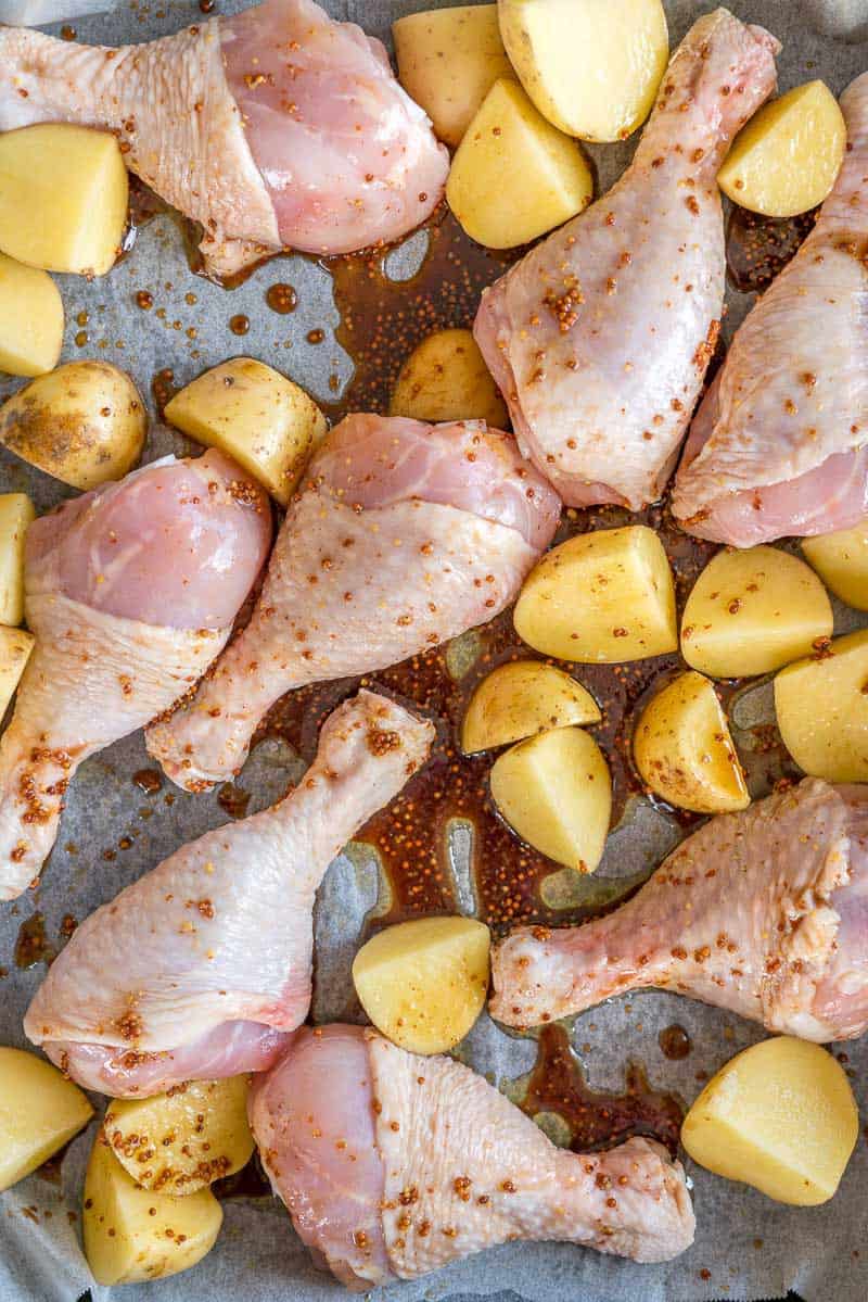 Marinated Chicken and Potato ready for baking in a tray