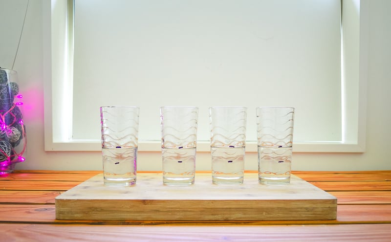 Four empty glasses marked to 100 ml