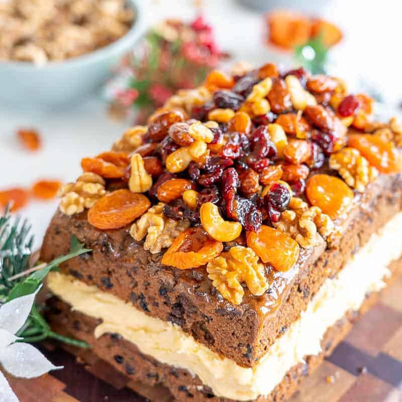 Christmas cake filled with buttercream and topped with a fruit and nut crust