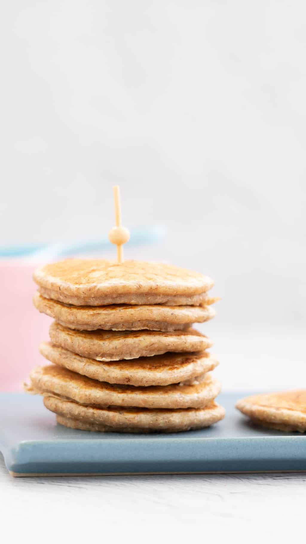 stack of wholemeal pikelets held together with a bamboo skewer