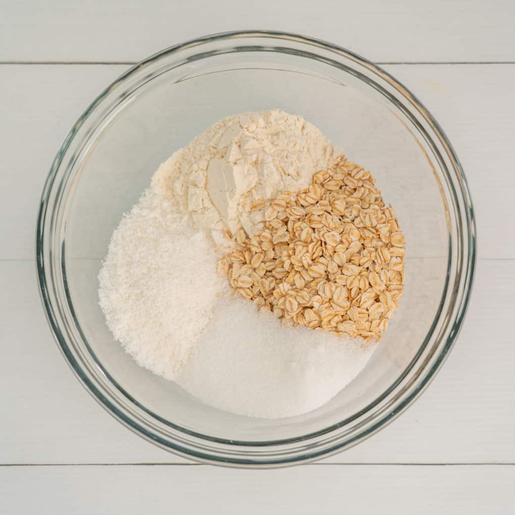 Dry ingredients for anzac biscuits in a bowl