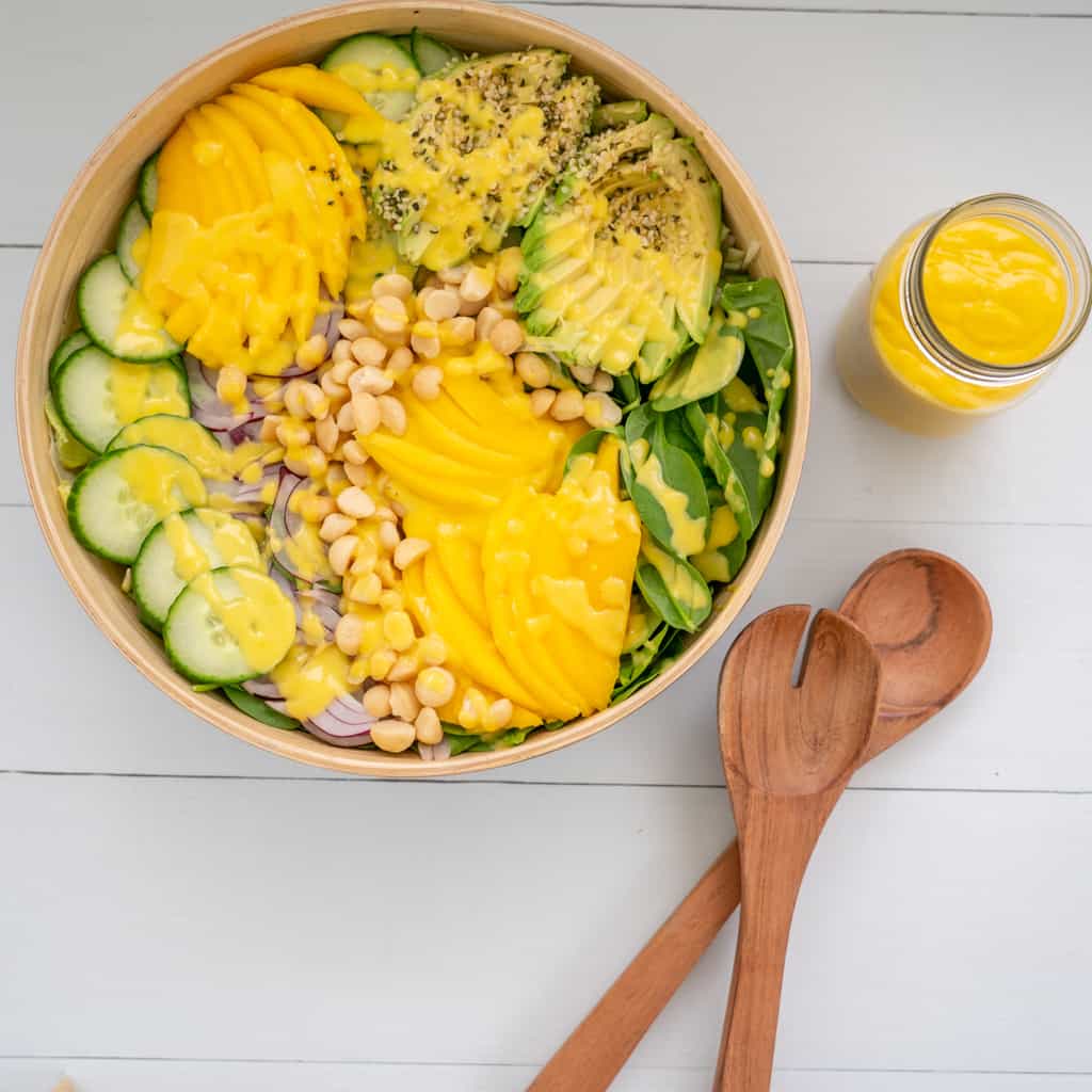 Salad of Avocado Mango and Macadamia nuts dressed with mango dressing