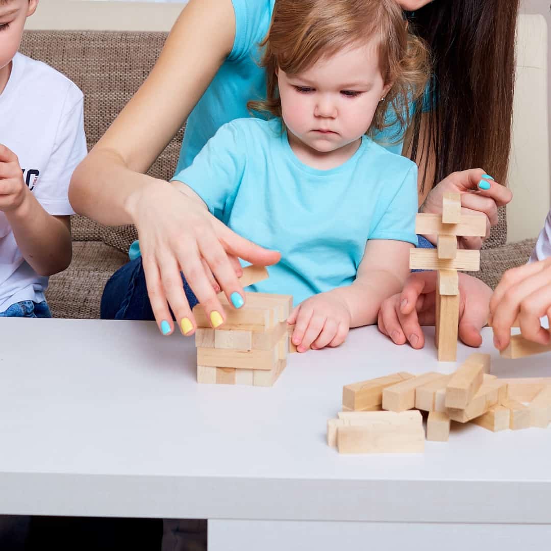 family playing jenga