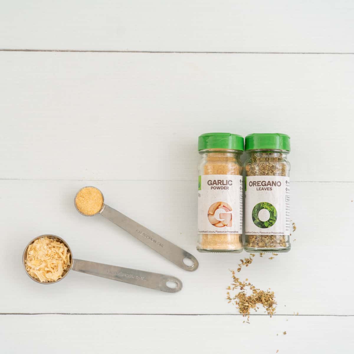 onion flakes, onion powder, fried oregano on a table top