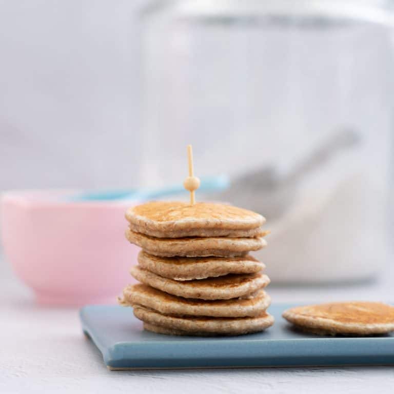 stack of wholemeal pikelets held together with a bamboo skewer