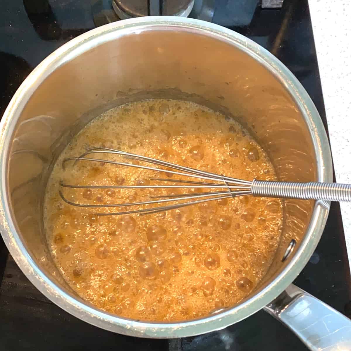 Maple Syrup Caramel bubbling on a stove top