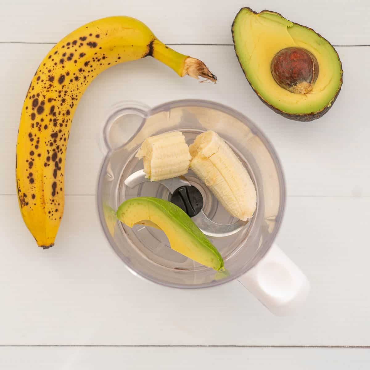 banana and avocado in a baby food blender