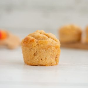 a mini applesauce muffin on a white counter top
