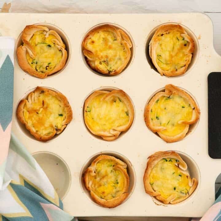 cooked bread cases in a white muffin tray