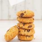 stack of 5 cornflake cookies on a white background, raisins visible