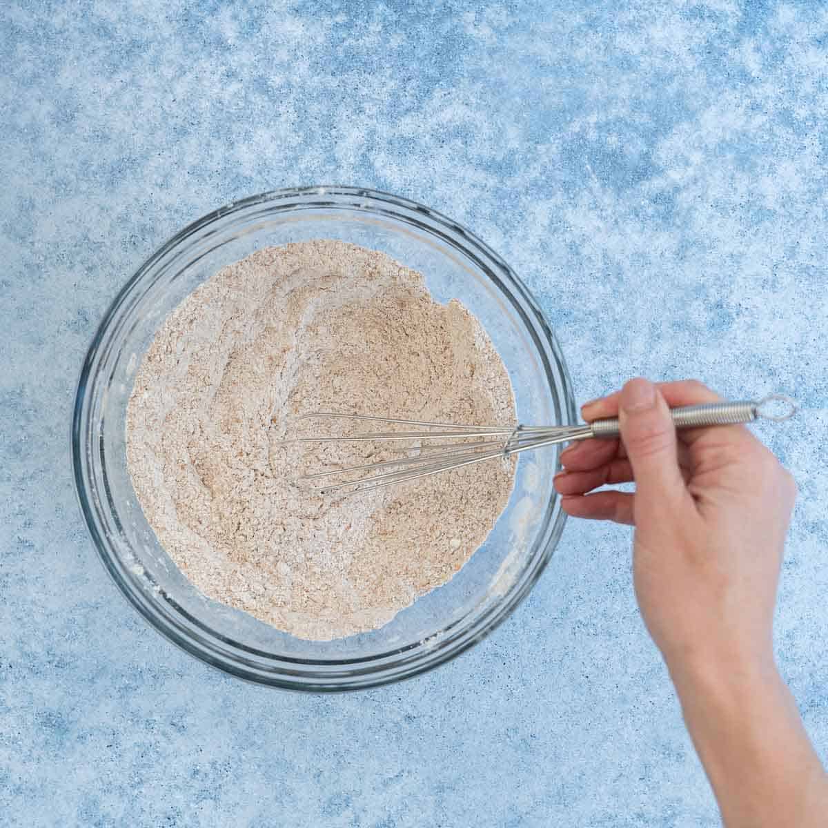 dry ingredients being combine with a whisk