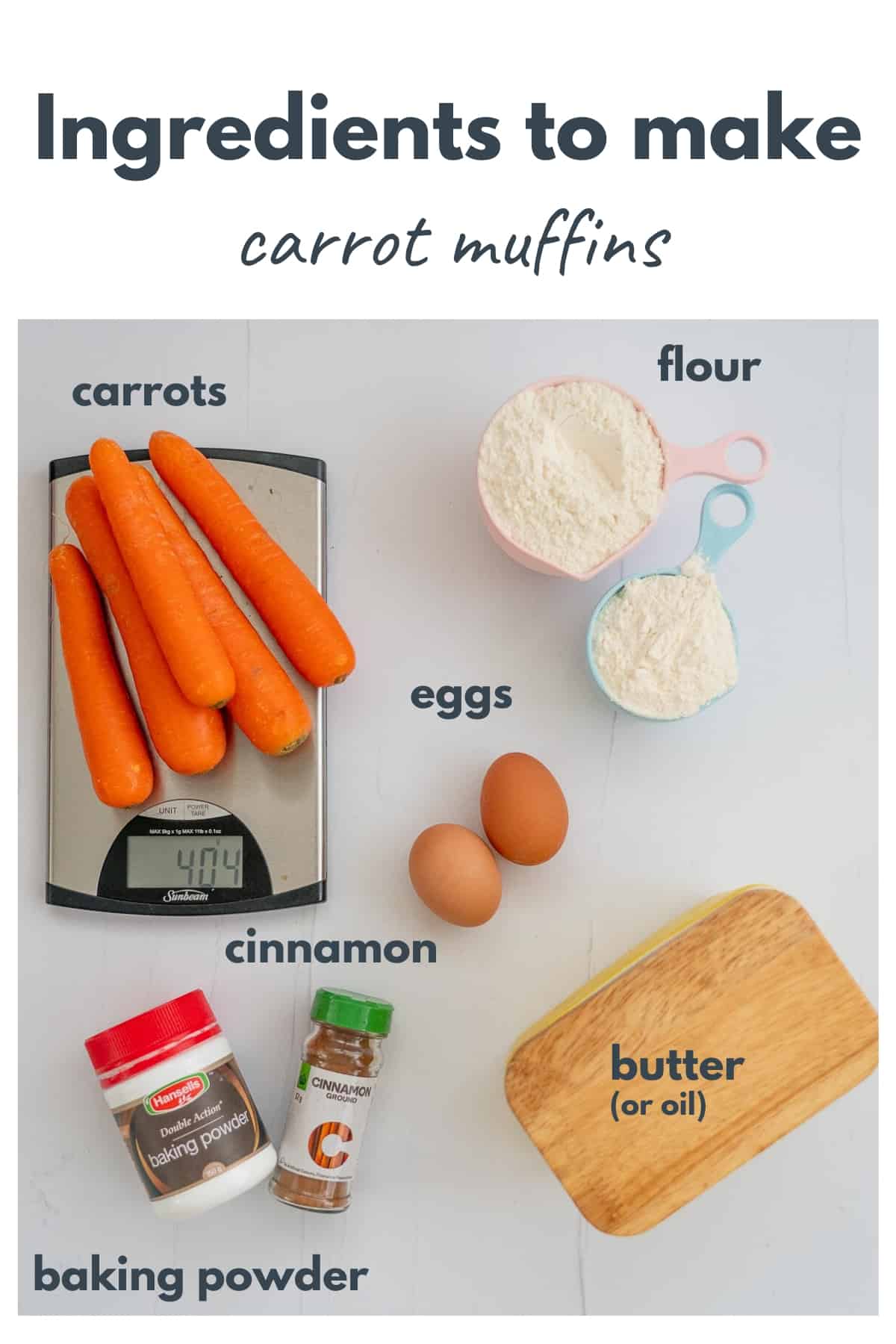 Ingredients for carrot muffins on a bench top with text overlay