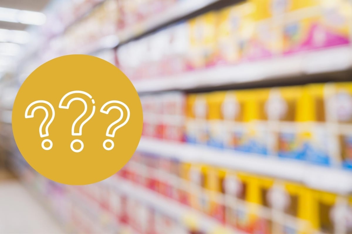 blurred image of baby formula on supermarket shelf with a question mark overlay