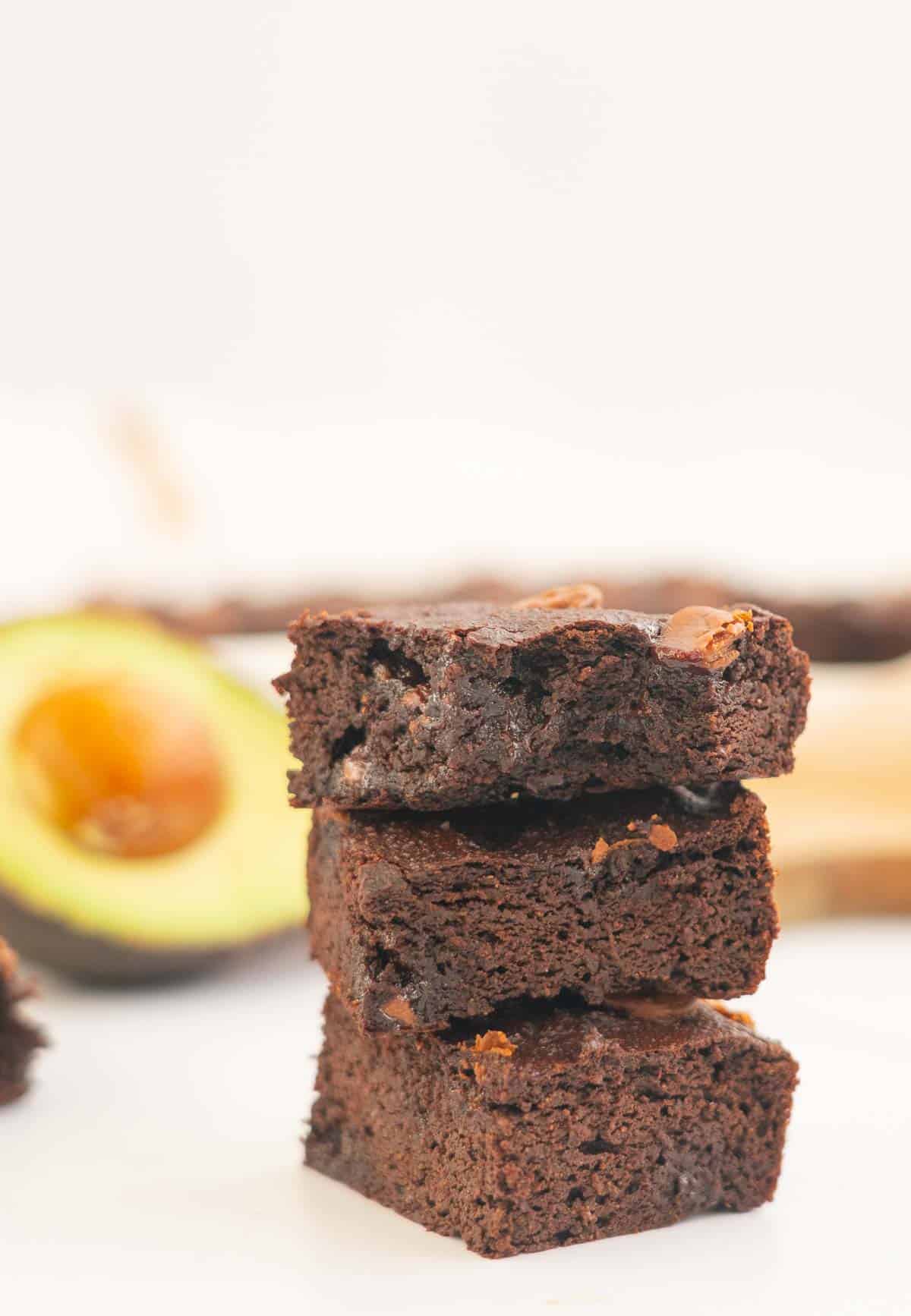 3 pieces of avocado brownie stacked on top of each other.