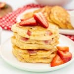 Stack of strawberry panckaes with text overlay