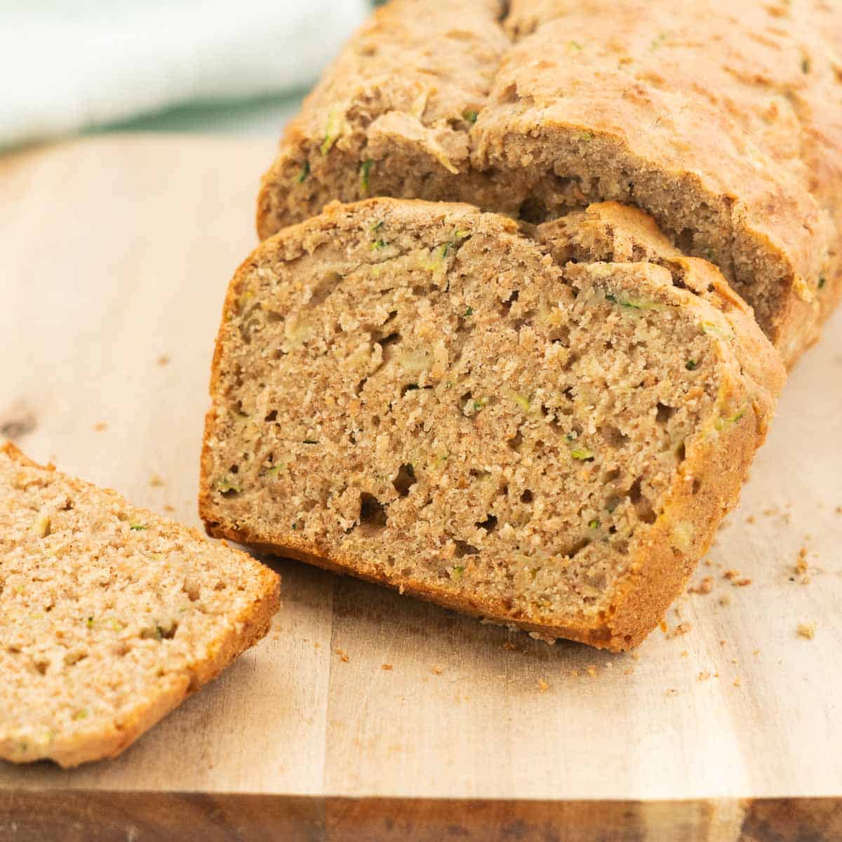 A close up of a slice of banana zucchini bread showing the texture. 