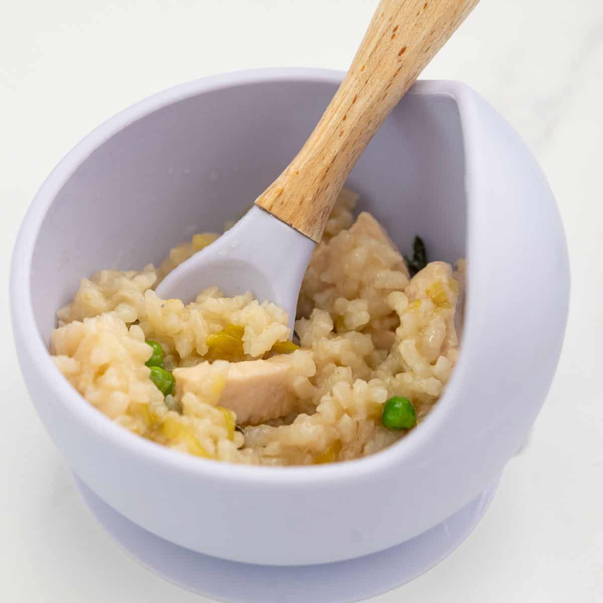 Chicken and leek risotto in a silicone baby bowl.