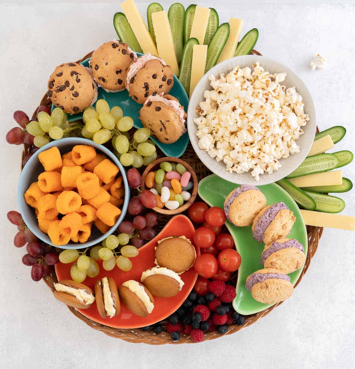 A large circular platter loaded with gluten free products and fresh produce.
