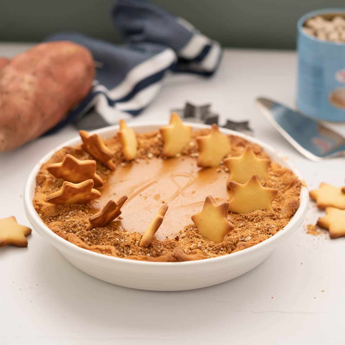 Sweet potato pie decorated with gingernut crumb and pastry star.