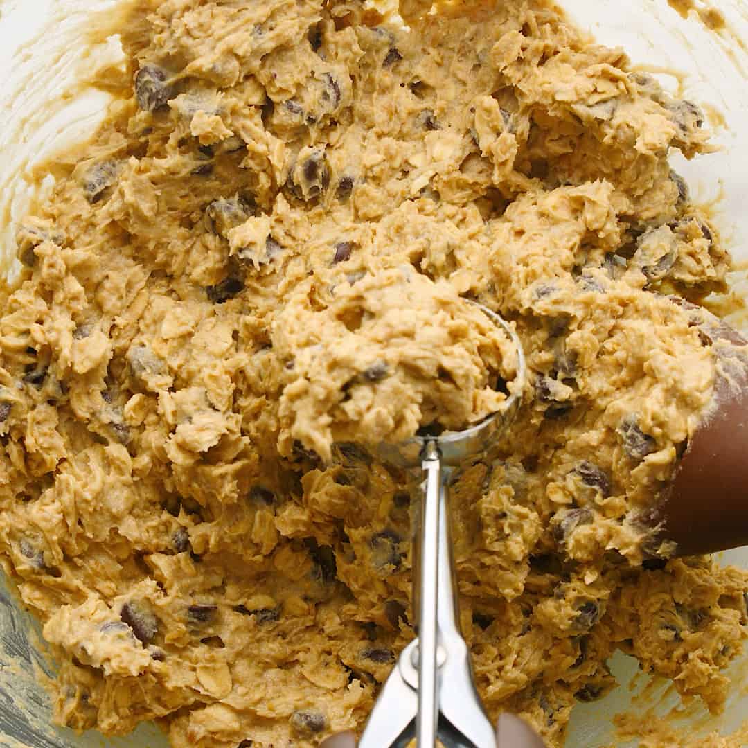 A bowl full of a sticky cookie dough.