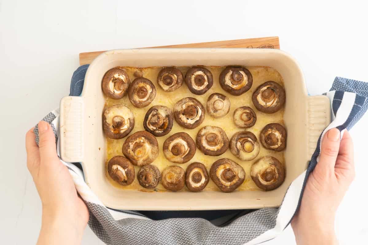 Roasted mushrooms in a rectangular baking dish.