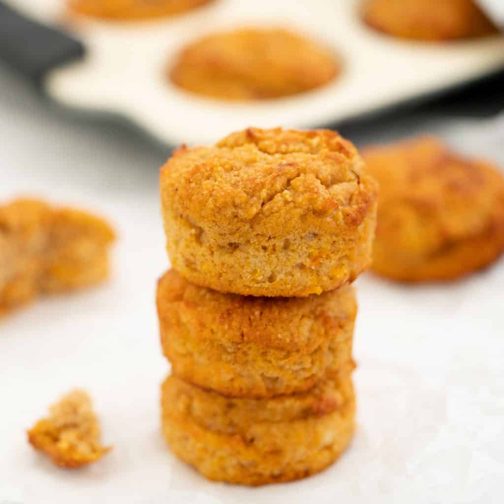 A tower of three sweet potato muffins.