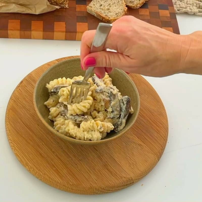 A bowl of creamy mushroom pasta.