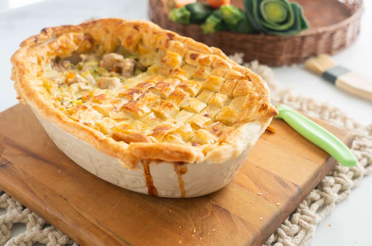 A chicken and leek pie topped with a lattice pastry design.