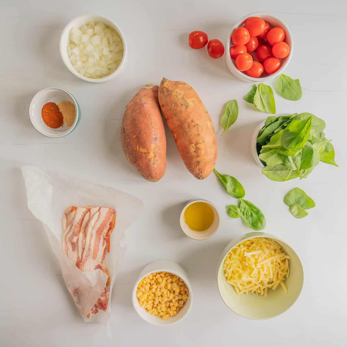 The ingredients to make loaded kumara chips laid out on a bench top.