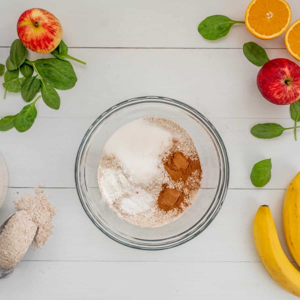 Dry ingredients sitting in a glass mixing bowl ready to be combined. 