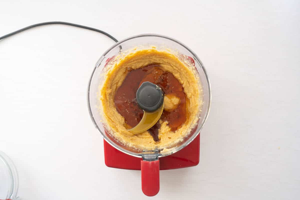 Chickpea puree and maple syrup in a food processor.