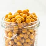 Golden roasted chickpeas in a glass jar,