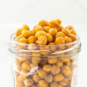 Golden roasted chickpeas in a glass jar,
