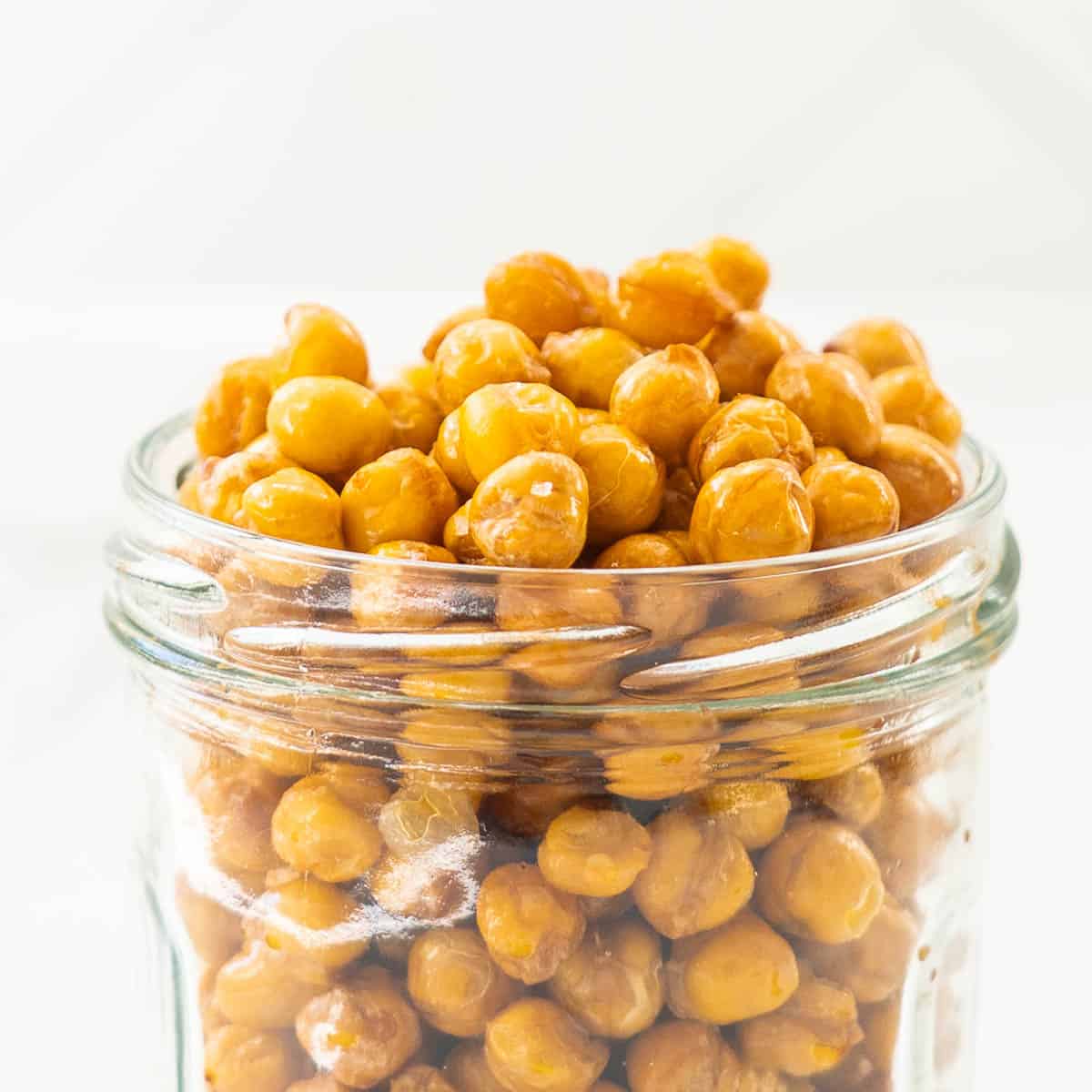 Golden roasted chickpeas in a glass jar,