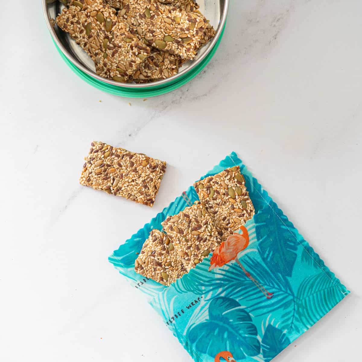 Three seeded crackers in a beeswax snack bag.
