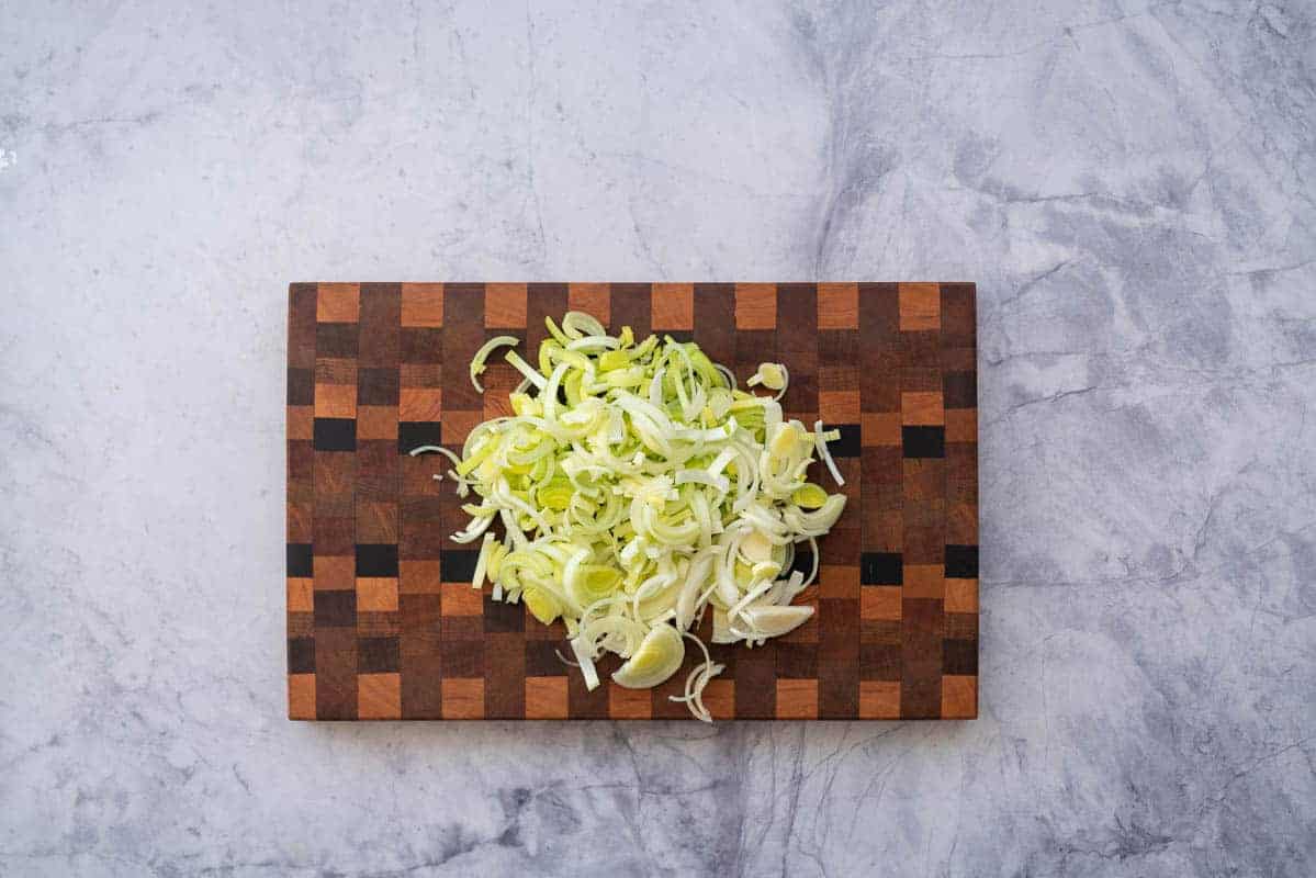 Sliced leek on a wooden chopping boards