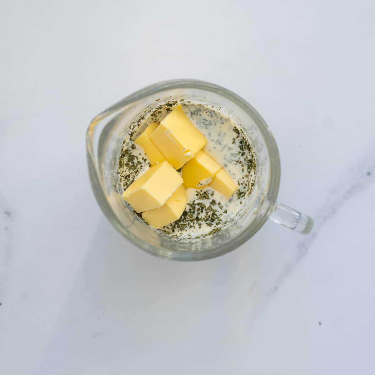 Cream, parsley and cubed butter in a small microwave proof jug.